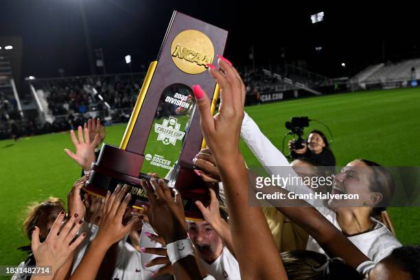 The Florida St. Seminoles celebrate with the trophy after a win against the Stanford Cardinal during the 2023 Division I Women's Soccer Championship...