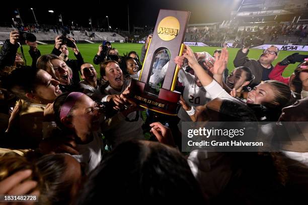 The Florida St. Seminoles celebrate with the trophy after a win against the Stanford Cardinal during the 2023 Division I Women's Soccer Championship...