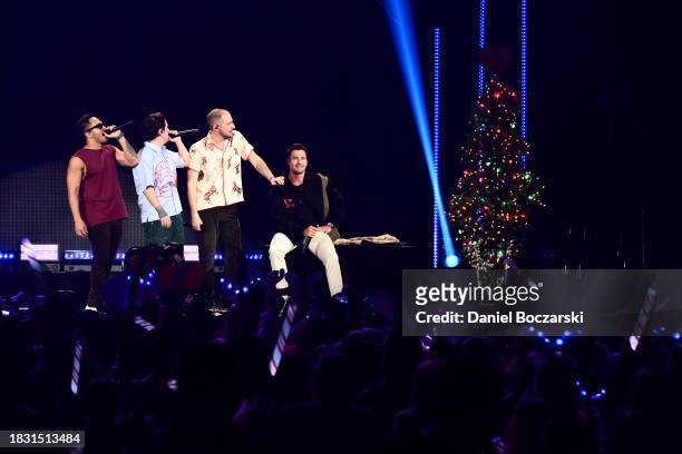 Carlos PenaVega, Logan Henderson, Kendall Schmidt, and James Maslow of Big Time Rush perform onstage during iHeartRadio 103.5 KISS FM's Jingle Ball...
