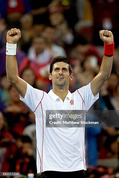 Novak Djokovic of Serbia celebrates his win over Richard Gasquet of France during the semifinals of the 2013 China Open at the National Tennis Center...