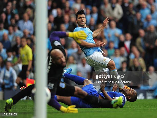 Sergio Aguero of Manchester City shoots past Sylvain Distin and Tim Howard of Everton to score his team's second goal during the Barclays Premier...