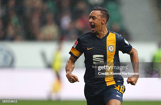 Karim Bellarabi of Braunschweig celebrates scoring his teams opening goal during the Bundesliga match between VfL Wolfsburg and Eintracht...