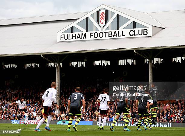 Giorgos Karagounis of Fulham takes a free kick during the Barclays Premier League match between Fulham and Stoke City at Craven Cottage on October 5,...
