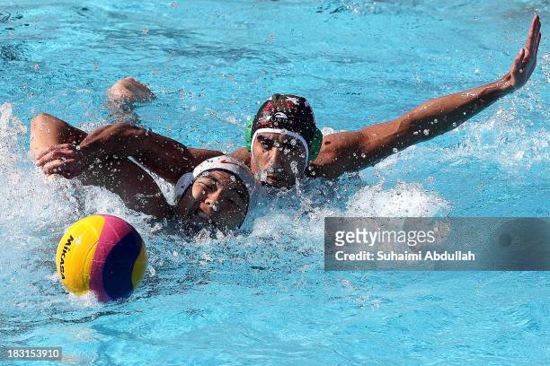 Gao Ying Yi of China and Marzouq Al-Ajmi of Kuwait battle for the ball during the Asian Water Polo Cup between China and Kuwait at Toa Payoh Swimming...