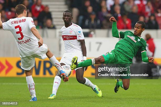 Daniel Schwaab of Stuttgart and his team mate Antonio Ruediger battle for the ball with Theodor Gebre Selassie of Bremen during the Bundesliga match...