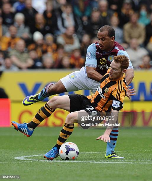 Stephen Quinn of Hull City vies with Gabriel Agbonlahor of Aston Villa during the Barclays Premier League match between Hull City and Aston Villa at...