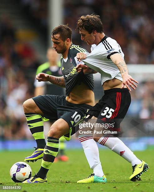 Marko Arnautovic of Stoke City is closed down by Fernando Amorebieta of Fulham during the Barclays Premier League match between Fulham and Stoke City...