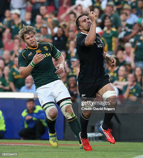 Liam Messam of the All Blacks celebrates after scoring his second try during the Rugby Championship match between South Africa Springboks and the New...