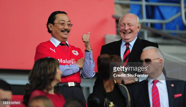 Ex Labour leader Neil Kinnock shares a joke with Cardiff owner Vincent Tan before the Barclays Premier League match between Cardiff City and...