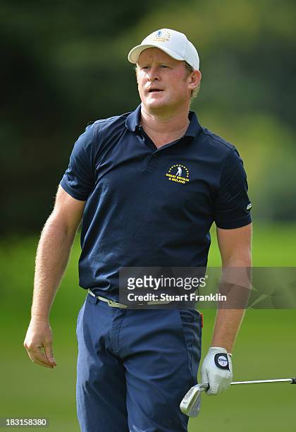 Jamie Donaldson of Great Britain and Ireland team plays a shot during the third day's afternoon foursomes at the Seve Trophy at Golf de...