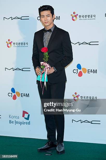 Taecyeon of South Korean boy band 2PM arrives for APAN Star Road during the 18th Busan International Film Festival at the Haeundae Beach BIFF Village...