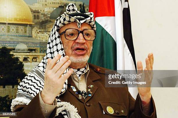 Palestinian leader Yasser Arafat makes a speech during a meeting in his headquarters in the West Bank town of Ramallah on March 5, 2003. Arafat...