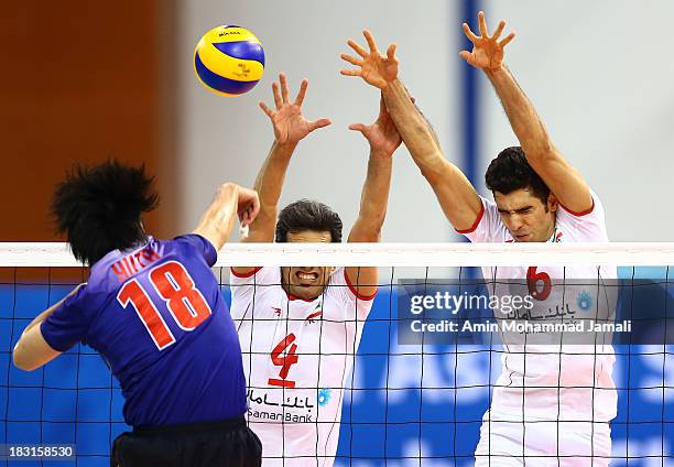 Yoneyama Yuta of Japan and Mir Saeed Marouf and Seyed Mohammad Mousavi during 17th Asian Men's Volleyball Championship between Iran And Japan on...