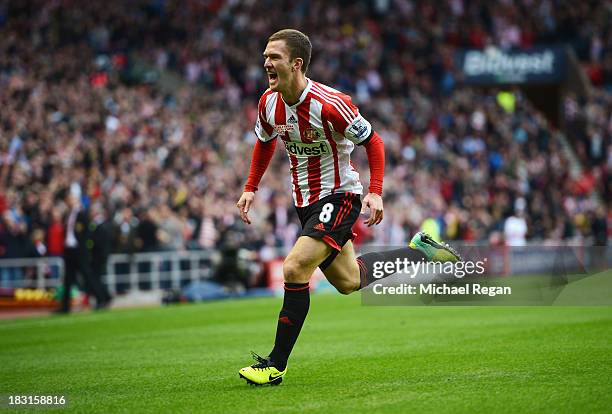 Craig Gardner of Sunderland celebrates scoring the opening goal during the Barclays Premier League match between Sunderland and Manchester United at...