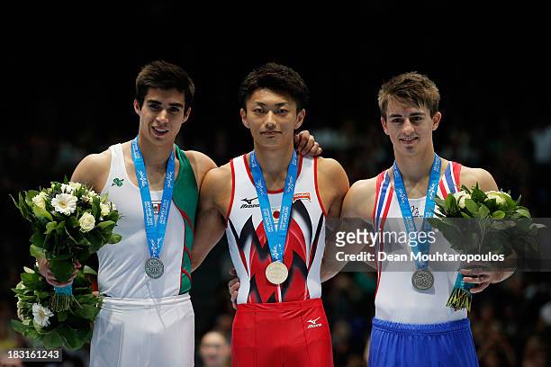 Daniel Corral Barron of Mexico, Kohei Kameyama of Japan and Max Whitlock of Great Britain pose after the Pommel Horse Final on Day Six of the...