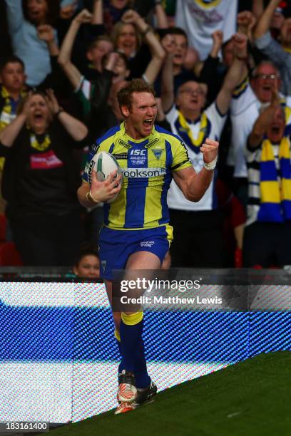 Joel Monaghan of Warrington celebrates after scoring his team's first try during the Super League Grand Final between Warrington Wolves and Wigan...