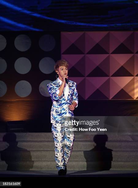 Isaac Teng of Malaysia sings during the 13th Global Chinese Music Awards at Putra Stadium on October 5, 2013 in Kuala Lumpur, Malaysia.