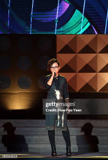 Bibi Chou of China sings during the 13th Global Chinese Music Awards at Putra Stadium on October 5, 2013 in Kuala Lumpur, Malaysia.