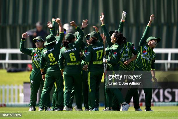 Pakistan celebrate after winning game two of the T20 International Women's series between New Zealand and Pakistan at University of Otago Oval on...