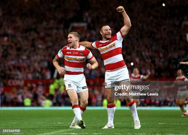 Sam Tomkins and Blake Green of Wigan celebrate their team's 30-16 victory during the Super League Grand Final between Warrington Wolves and Wigan...