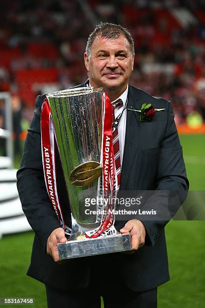 Shaun Wane the Wigan head coach poses with the trophy following his team's 30-16 victory during the Super League Grand Final between Warrington...