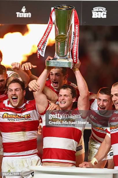 Sean O'Loughlin the captain of Wigan Warriors lifts the winners trophy during the Super League Grand Final between Warrington Wolves and Wigan...