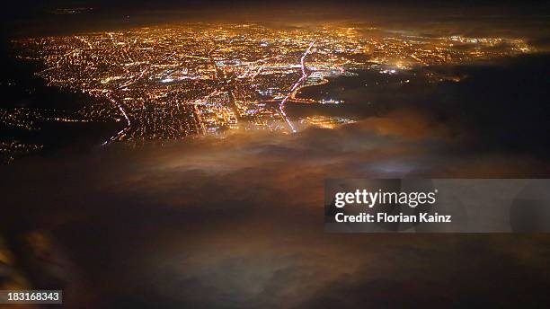 air travel - city lights below - san jose california city stock pictures, royalty-free photos & images