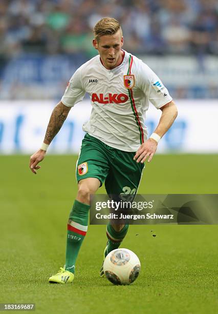 Andre Hahn of Augsburg controls the ball during the Bundesliga match between FC Schalke 04 and FC Augsburg at Veltins-Arena on October 5, 2013 in...