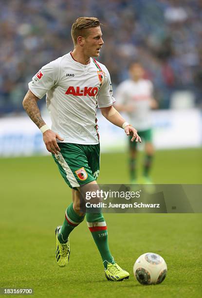 Andre Hahn of Augsburg controls the ball during the Bundesliga match between FC Schalke 04 and FC Augsburg at Veltins-Arena on October 5, 2013 in...