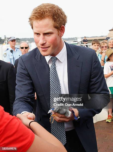 Prince Harry greets fans at Campbell Cove on October 5, 2013 in Sydney, Australia. Over 50 ships participate in the International Fleet Review at...