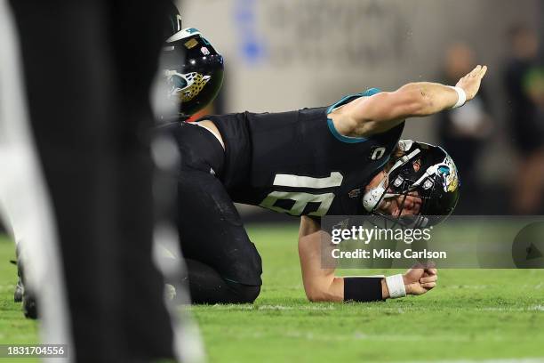 Trevor Lawrence of the Jacksonville Jaguars reacts after being injured against the Cincinnati Bengals during the fourth quarter at EverBank Stadium...