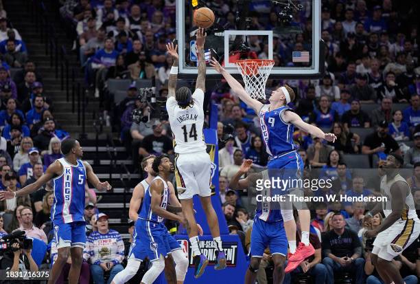 Brandon Ingram of the New Orleans Pelicans shoots the ball against Kevin Huerter of the Sacramento Kings in the second quarter of an NBA In-Season...