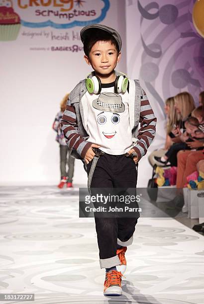 Model walks the runway at the Truly Scrumptious for Babies "R" Us designed by Heidi Klum at Vogue Bambini petiteParade Kids Fashion Week on October...