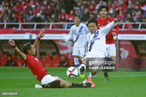 Yasuyuki Konno of Gamba Osaka scores the team's first goal during the J.League Championship semi final between Urawa Red Diamonds and Gamba Osaka at...