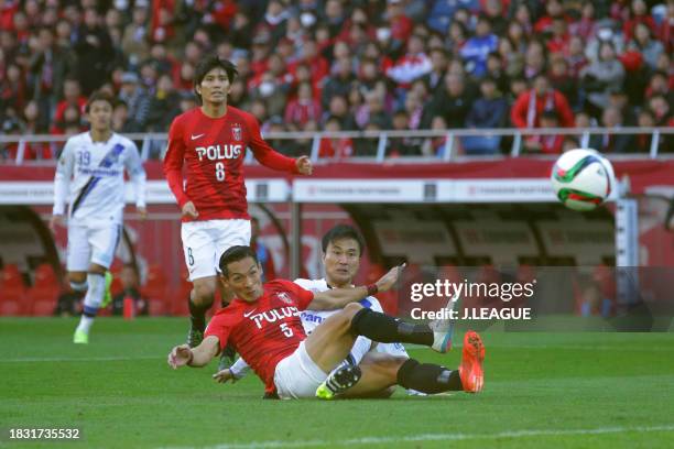 Yasuyuki Konno of Gamba Osaka scores the team's first goal during the J.League Championship semi final between Urawa Red Diamonds and Gamba Osaka at...