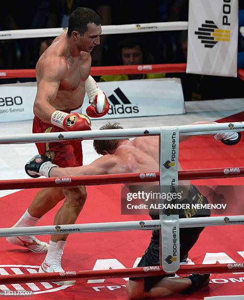 Ukrainian heavyweight boxing world champion Vladimir Klitschko punches Russian heavyweight boxer Alexander Povetkin during their fight in Moscow on...