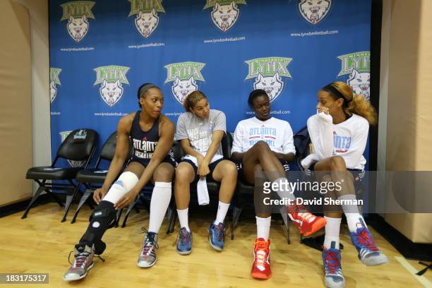 Le'coe Willingham, Courtney Clements, Aneika Henry and Jasmine Thomas of the Atlanta Dream wait for practice to start during the 2013 WNBA Finals on...