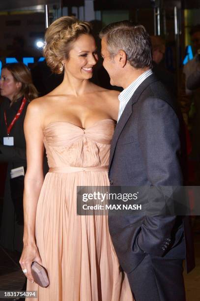Actor George Clooney smiles with his girl friend Stacy Kiebler as they arrive for the British Premiere of his latest film 'The Descendants', in...