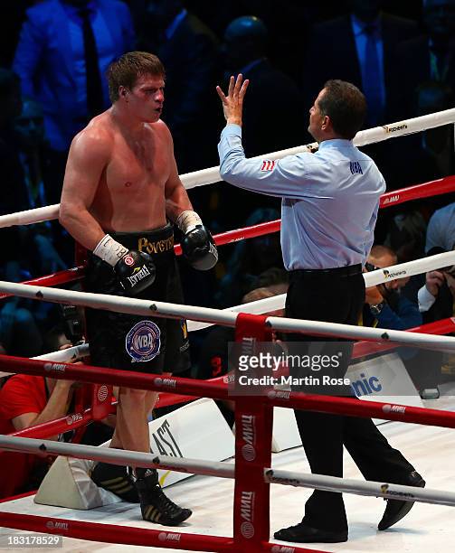 Referee Luis Pabon of Costa Rica counts to Alexander Povetkin of Russia during their WBO, WBA, IBF and IBO heavy weight title fight between Wladimir...