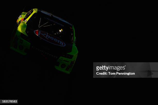 Paul Menard, driver of the Rheem / Menards Chevrolet, races during the NASCAR Nationwide Series 13th Annual Kansas Lottery 300 at Kansas Speedway on...
