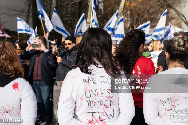 More than hundreds activists, mostly women, rally at Dag Hammarskjold Plaza on December 4, 2023 in New York in support of Israeli women sexually...