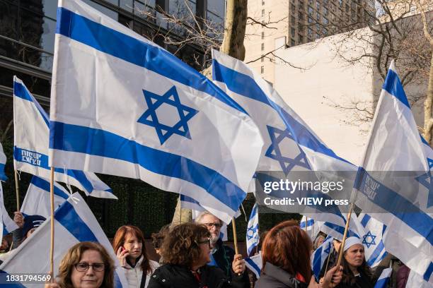 More than hundreds activists, mostly women, rally at Dag Hammarskjold Plaza on December 4, 2023 in New York in support of Israeli women sexually...