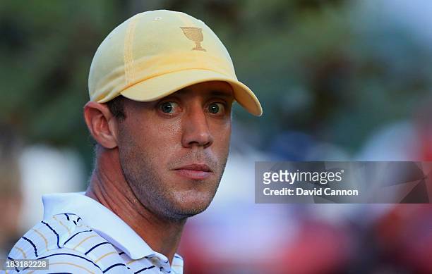 Graham deLaet of Canada and the International Team walks off a tee during the Day Three Foursome Matches at the Muirfield Village Golf Club on...