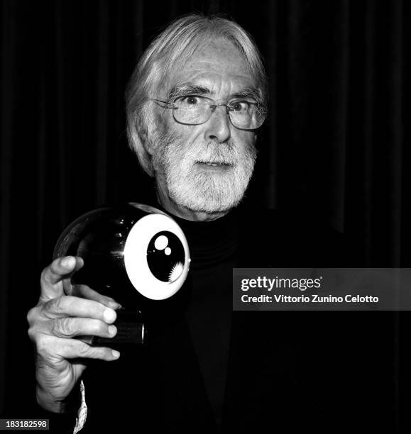 Director Michael Haneke poses with the 'A tribute to Michael Haneke' award on October 5, 2013 in Zurich, Switzerland.