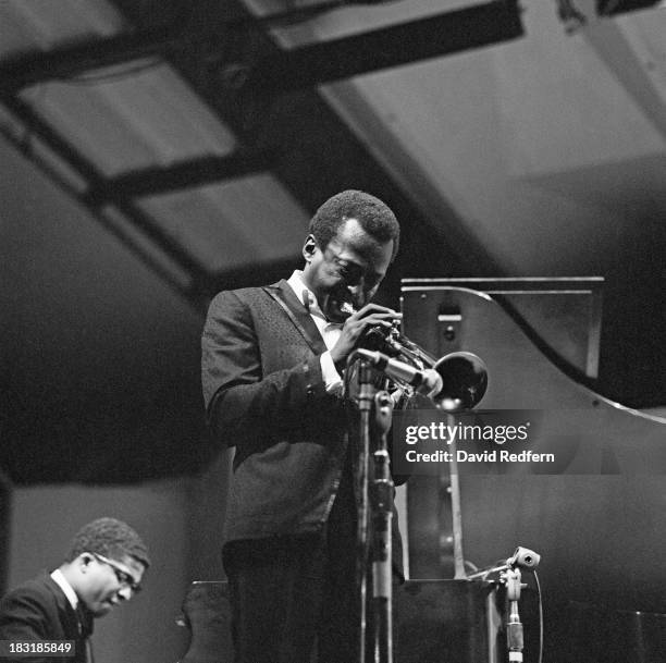 American jazz musician and composer Miles Davis performing at the Newport Jazz Festival, Newport, Rhode Island, 2nd July 1967. On the left is pianist...