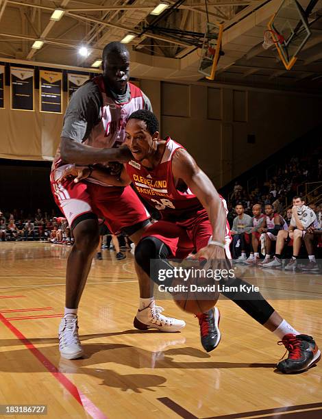 Kenny Kadji of the Cleveland Cavaliers drives to the hoop against DeSagana Diop of the Cleveland Cavaliers during their annual Wine & Gold Scrimmage...