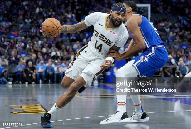 Brandon Ingram of the New Orleans Pelicans looks to drive to the basket on Keegan Murray of the Sacramento Kings in the third quarter of an NBA...