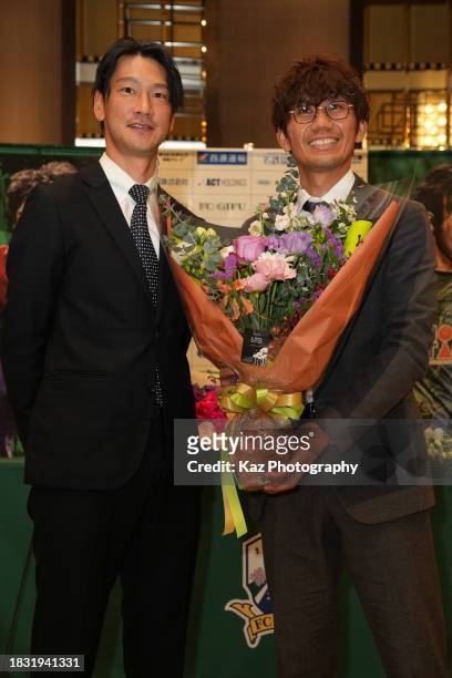 Yosuke Kashiwagi of FC Gifu is presented a bouquet of flowers by Yojiro Takahogi, former team mate of Sanfrecce Hiroshima, at his retirement press...