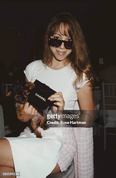 American singer-songwriter Mariah Carey attends a Chanel fashion show benefit to raise funds for the New York Hospital, New York City, 1994.