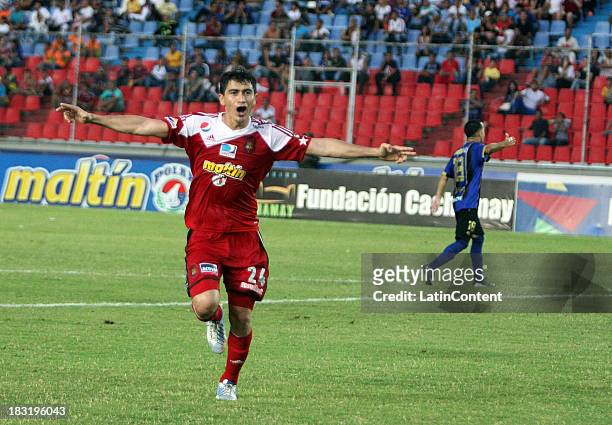 Rubert Quijada of Caracas FC celebrates a goal during a match between AC Mineros de Guayana and Caracas FC as part of the Apertura 2013 at Cachamay...